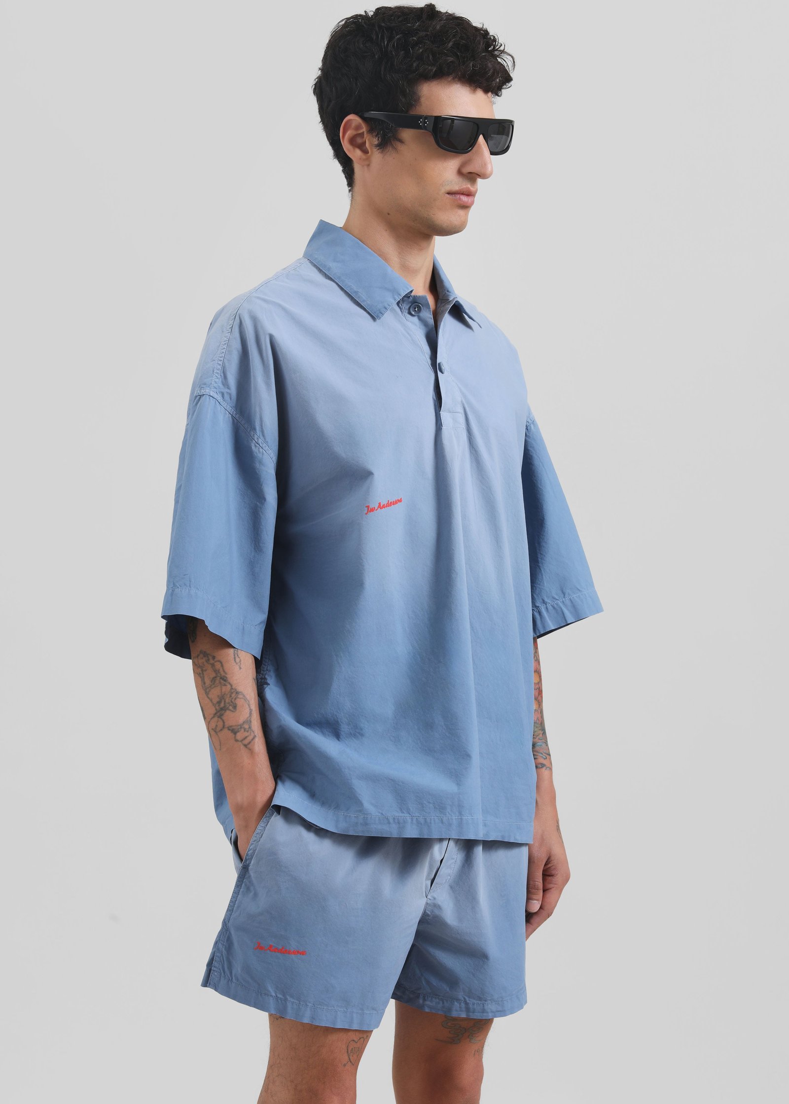 JW-ANDERSON-LOGO-PRINT-SHORTS-LIGHT-BLUE-GABRIEL-01221-1